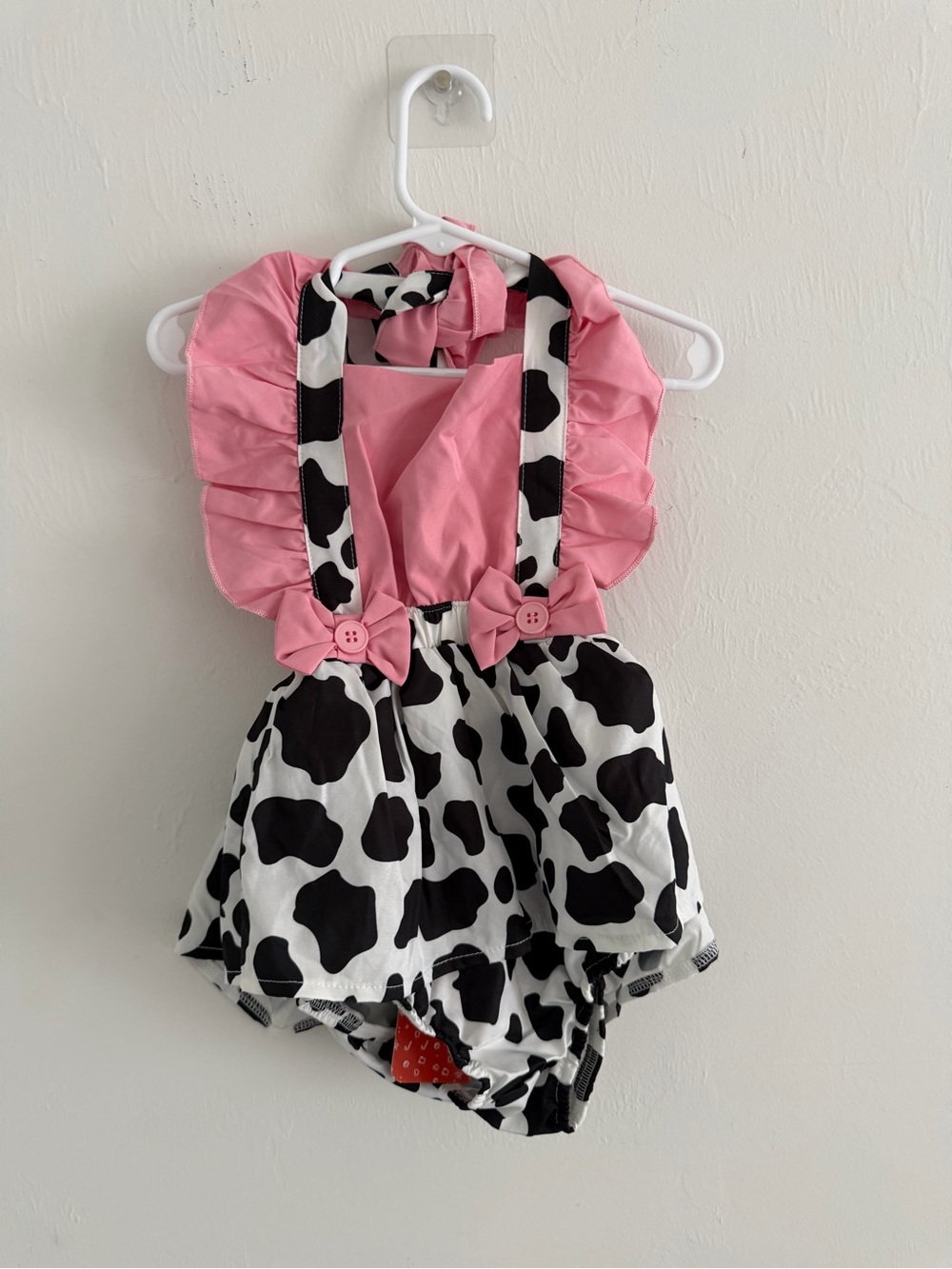 Others Follow Pink and Black Cow-Print Baby Romper with Ruffle Straps